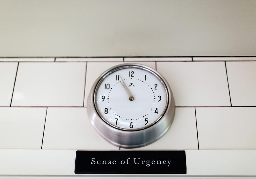 Wall clock; sense of urgency sign
